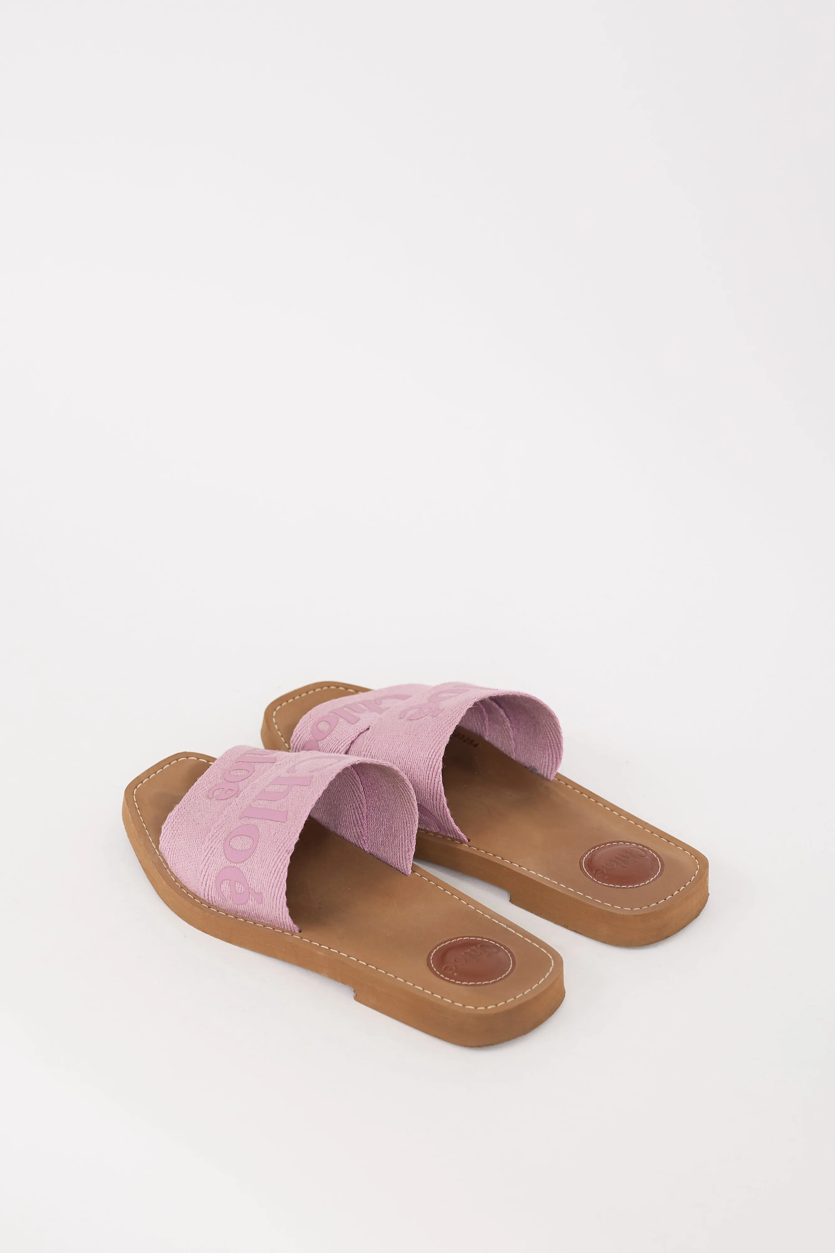 Brown & Pink Woody Logo Slide